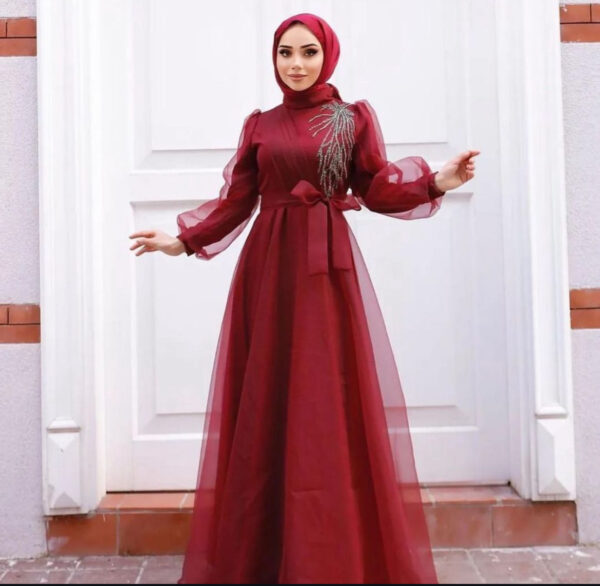 Burgundy Princess Hijab Dress worn by a model, showcasing a sophisticated and modest design, available at Noor Boutique in the GTA.