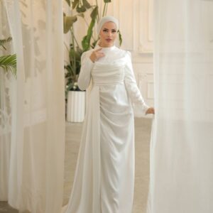 White Satin Evening Hijab Dress worn by a model, showcasing a luxurious and modest design, available at Noor Boutique in the GTA.