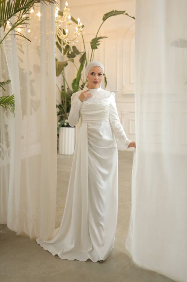 White Satin Evening Hijab Dress worn by a model, showcasing a luxurious and modest design, available at Noor Boutique in the GTA.