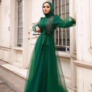 Green Princess Hijab Dress worn by a model, showcasing an elegant and modest design, available at Noor Boutique in the GTA.