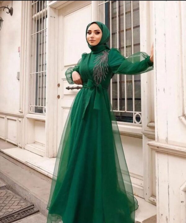 Green Princess Hijab Dress worn by a model, showcasing an elegant and modest design, available at Noor Boutique in the GTA.