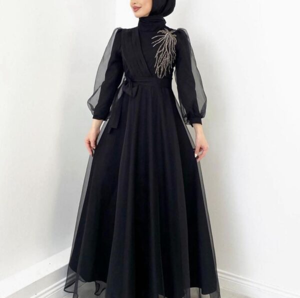 Black Princess Hijab Dress displayed on a model, showcasing an elegant and modest design, available at Noor Boutique in the GTA.