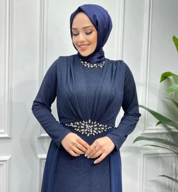 Navy Blue Evening Hijab Dress with Stones worn by a model, showcasing elegant embellishments and a modest design, available at Noor Boutique in the GTA.