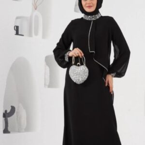 Black Crepe Evening Hijab Dress displayed on a mannequin, featuring a sophisticated and modest design, available at Noor Boutique in the GTA.