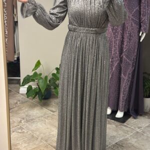 Silver Evening Hijab Dress worn by a model, featuring a shimmering fabric and a graceful modest design, available at Noor Boutique in the GTA.