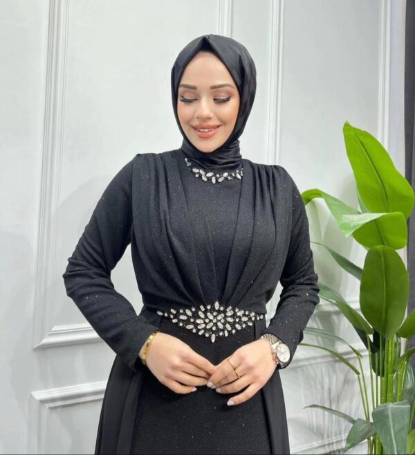 Black Evening Hijab Dress with Shiny Stones worn by a model, showcasing elegant embellishments and a modest design, available at Noor Boutique in the GTA.