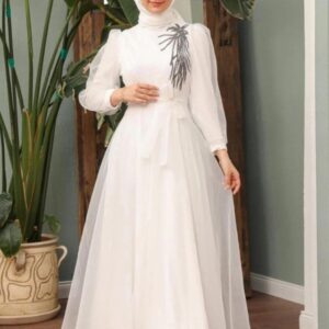 White Princess Hijab Dress worn by a model, showcasing a graceful and modest design, available at Noor Boutique in the GTA.