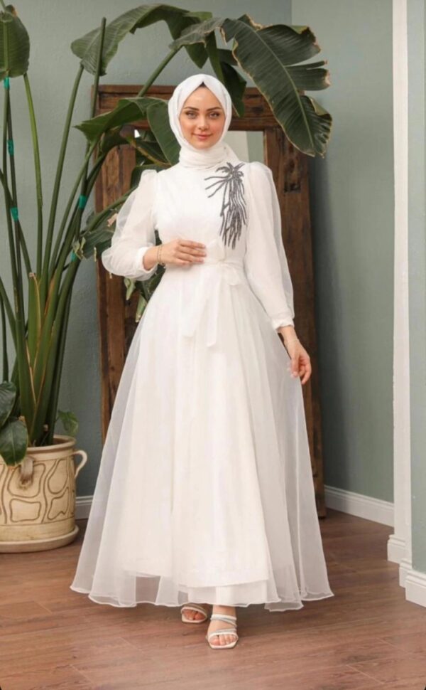 White Princess Hijab Dress worn by a model, showcasing a graceful and modest design, available at Noor Boutique in the GTA.