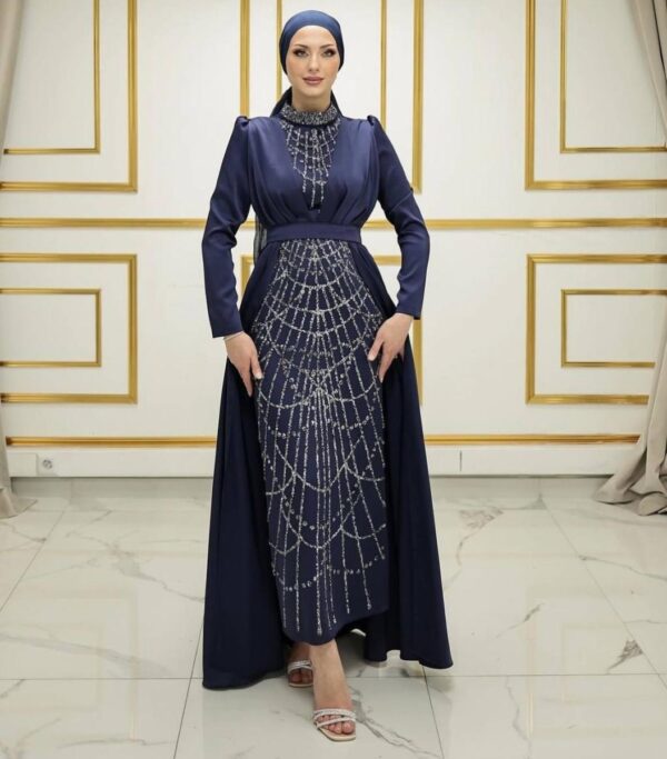 Navy Blue Evening Dress with Shiny Stones worn by a model, featuring elegant embellishments and a modest design, available at Noor Boutique in the GTA.