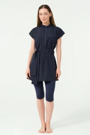 Navy blue modest swimsuit with short sleeves for youth and adults, featuring a long top and full-length leggings.