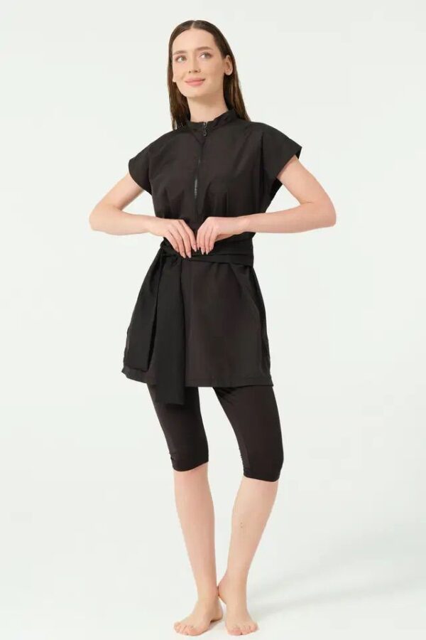 Black short sleeve modest swimsuit for youth and adults featuring a long top and full-length leggings.